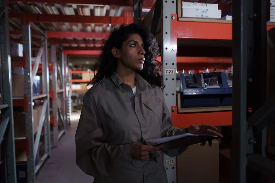 Warehouse worker inspecting returned products in Mexico cross-border logistics