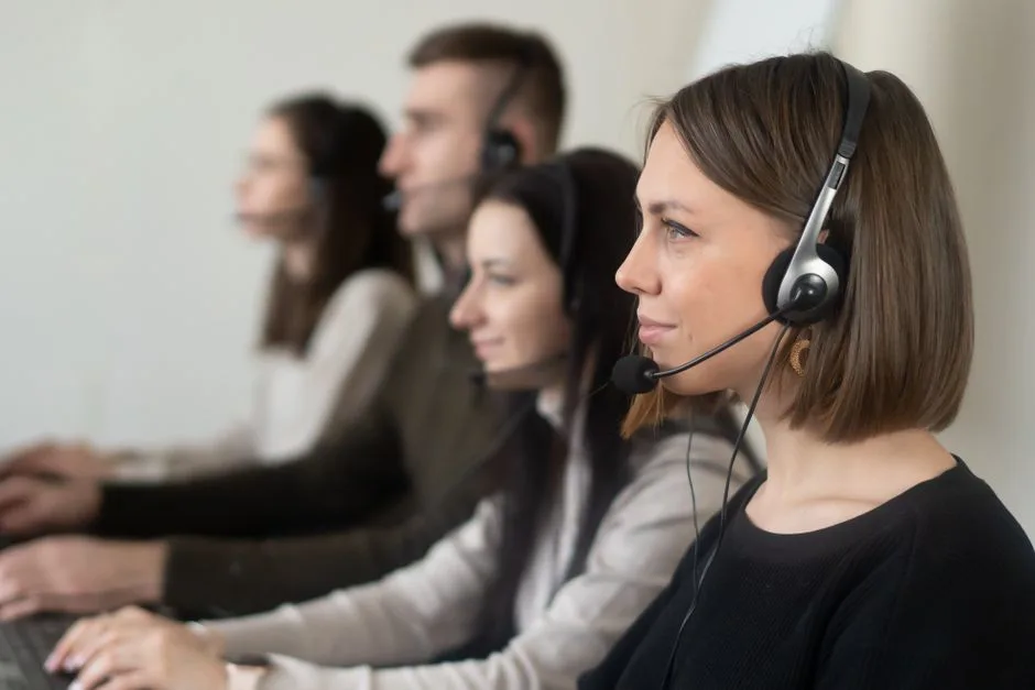 Customer service agent in Mexico headset working at call center with Mexican flag